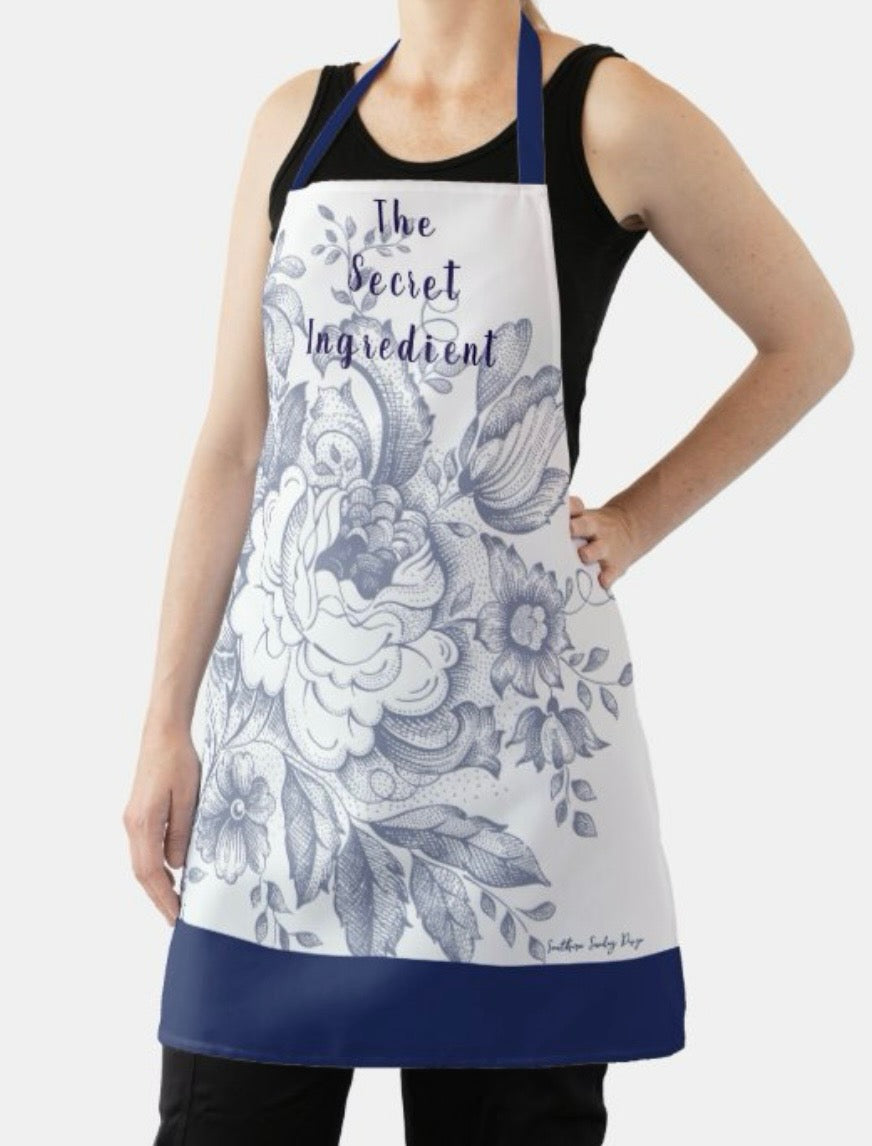 "The Secret Ingredient" Blue Floral Apron (Size Medium).   $30.00